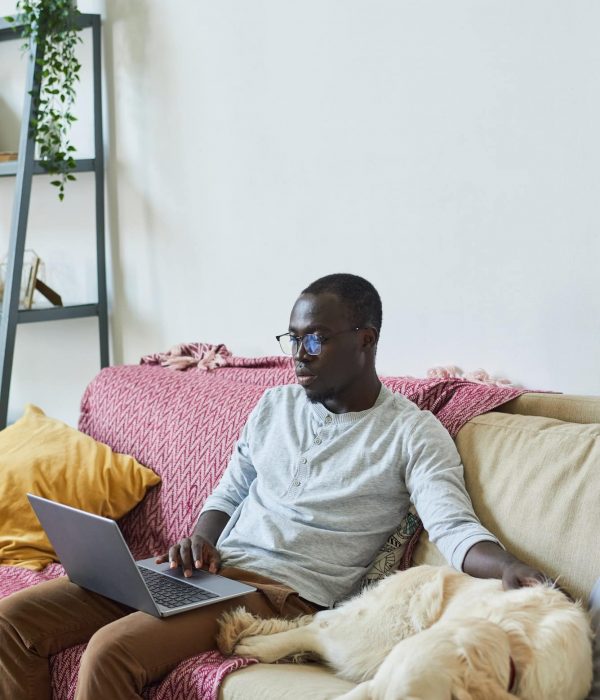 Man with laptop at home